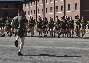 Members of Marine Corps Detachment Goodfellow warmup before participating in a moto-run at Goodfellow Air Force Base, Texas, Nov. 3, 2022. The moto-run played an integral role in promoting esprit de corps among the Marines. (U.S. Air Force photo by Airman 1st Class Zachary Heimbuch)