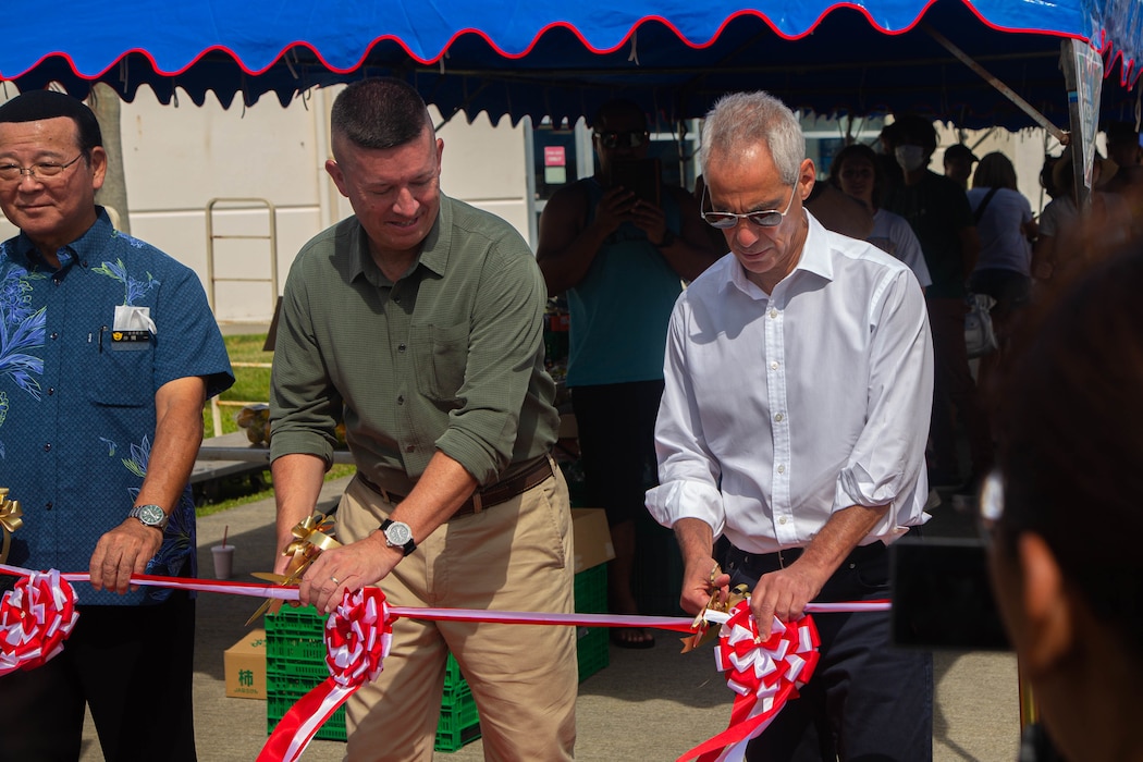 Hajime Nakama, left, the mayor of Kin, U.S. Marine Corps Lt. Gen. James Bierman, center, commanding general of III Marine Expeditionary Force, and Rahm Emanuel, right, the U.S. ambassador to Japan, cut the opening ribbon at the Farmers Market on Camp Hansen, Okinawa, Japan, Oct. 30, 2022. The Farmers Market was established to provide locally sourced produce to U.S. service members and their families. Events such as the Farmers Market strengthens local community relations by supporting local farmers and businesses. (U.S. Marine Corps photo by Lance Cpl. Ricardo Deseanogomez)