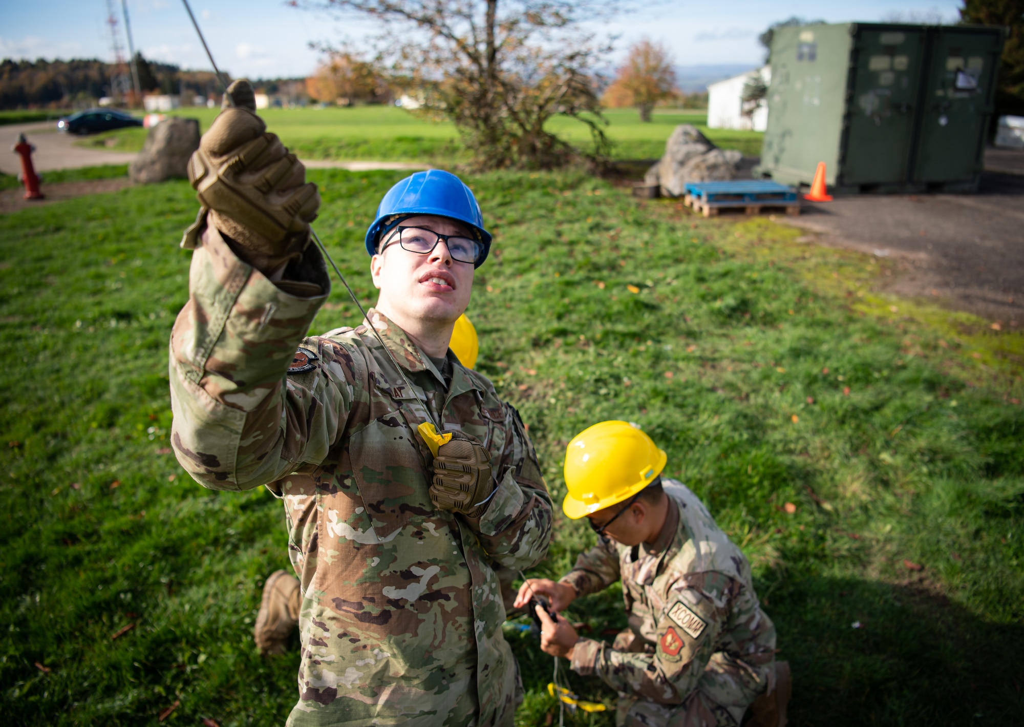 U.S. Air Force Airmen assigned to the 1st Combat Communications Squadron adjust antenna mast guy wires during Noble Skywave at U.S. Army Garrison Baumholder, Germany, Germany, Oct. 26, 2022. Military units from every corner of the globe participated in Noble Skywave, a contest to see which unit could operate a high frequency radio station the most effectively. (U.S. Air Force photo by Airman 1st Class Jared Lovett)