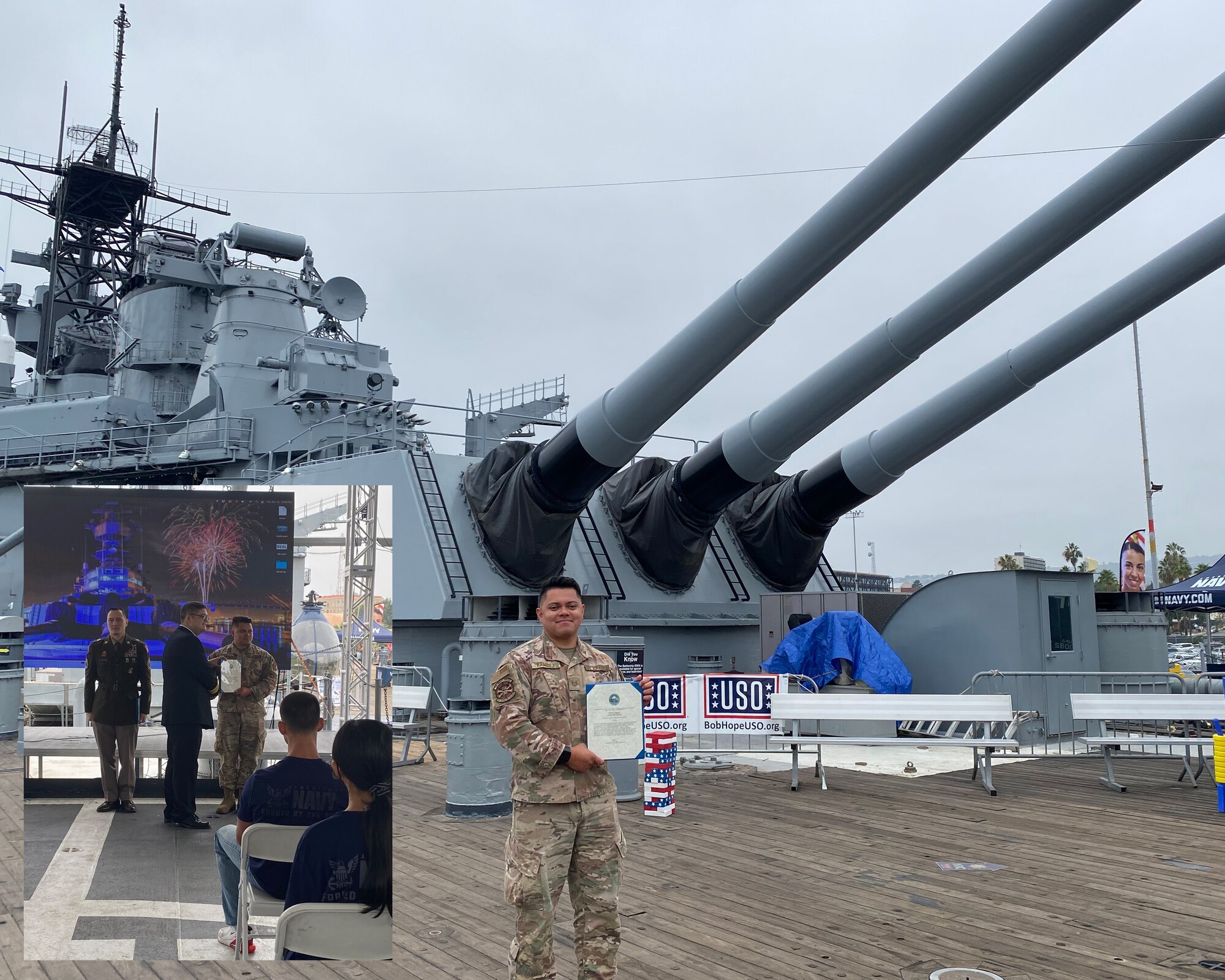 Air Force recruiter shows his Navy award while aboard USS Iowa
