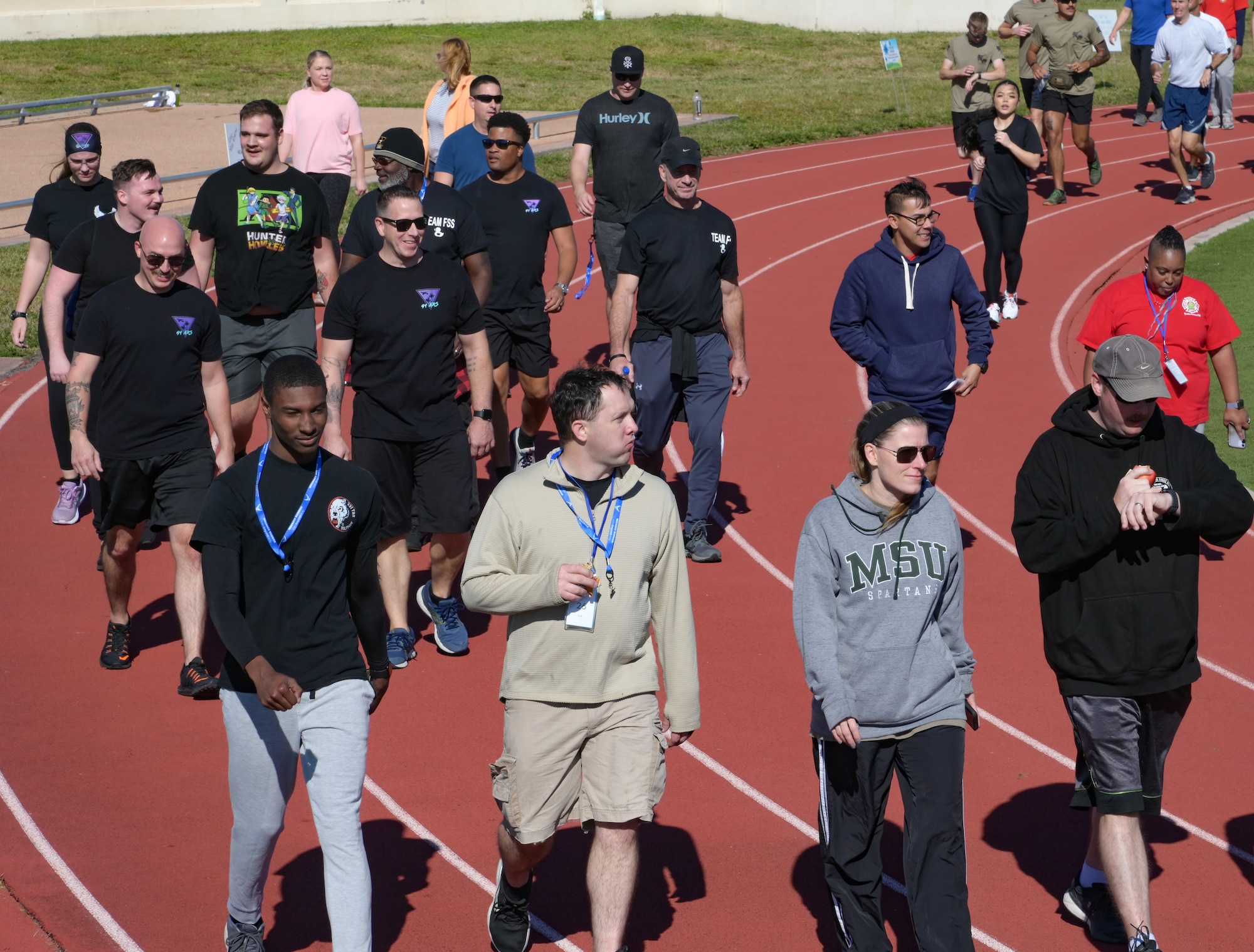 Airmen assigned to the 6th Air Refueling Wing walk around the track during the Miles for Life run at MacDill Air Force Base, Florida, Oct. 21, 2022.