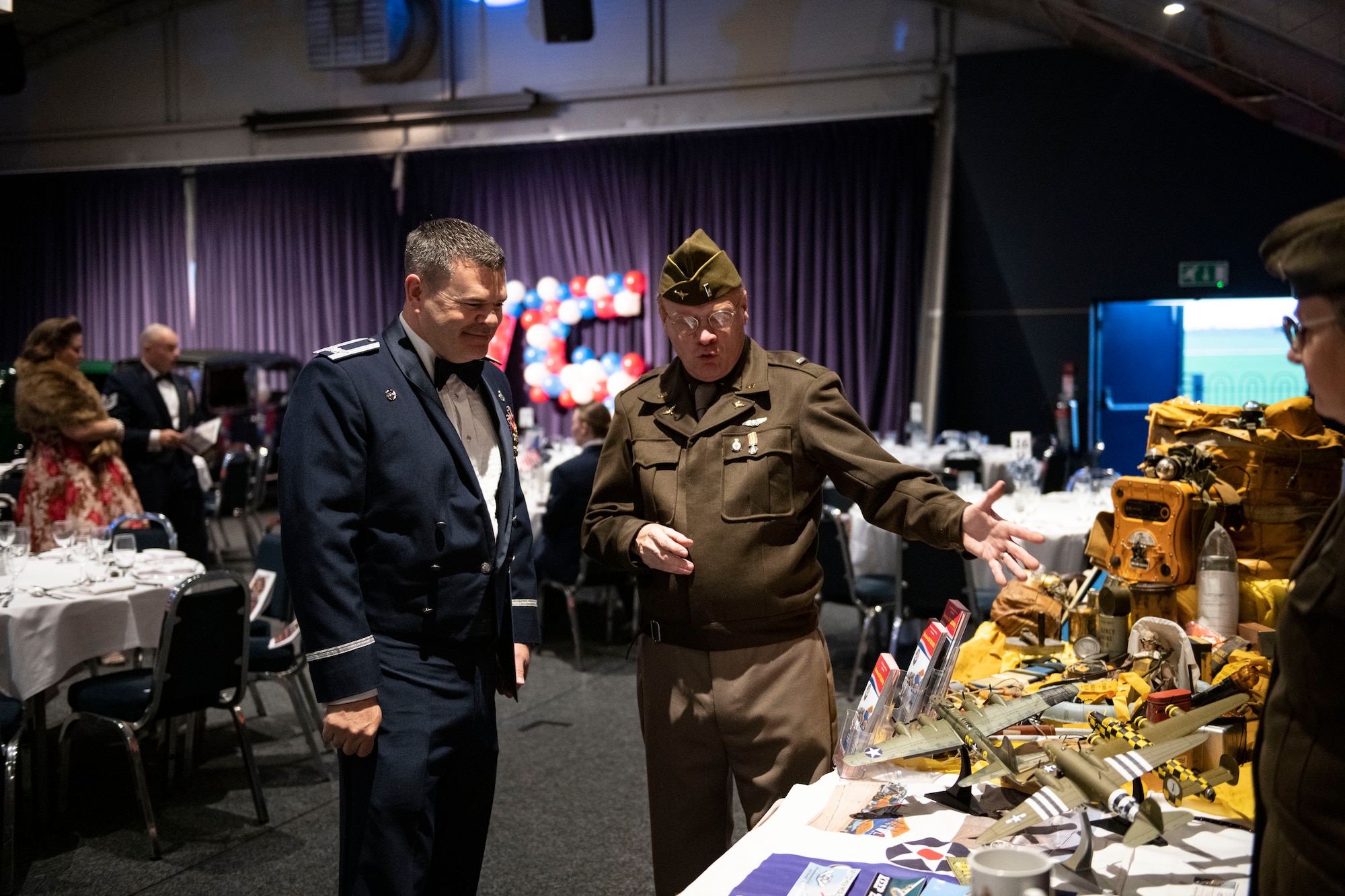 Duncan Aran, Commemorative Air Force member, right, shows Col. Brian Filler, 501st Combat Support Wing commander, the Commemorative Air Force display at the Sywell Aerodrome