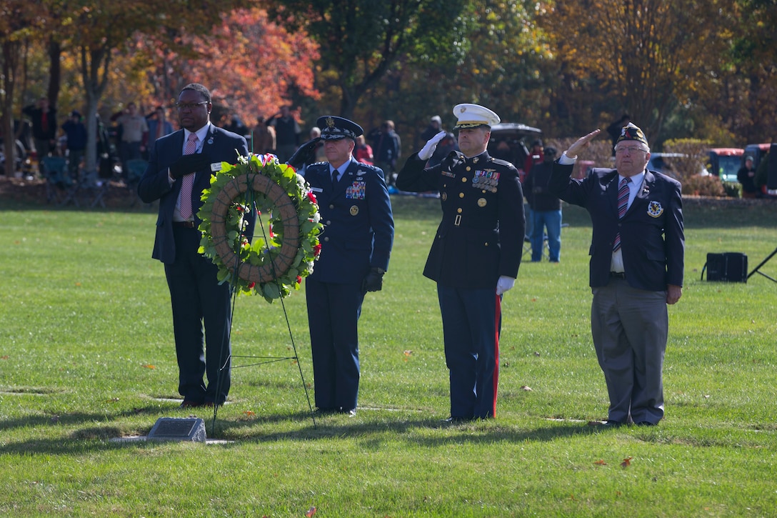 U.S. service members, veterans, and family members salute during the 36th annual Marine Corps Base Quantico Veterans Day Ceremony, at Quantico National Cemetery, Triangle, Va., Nov. 11, 2017. Veterans Day is a national holiday held on the anniversary of the end of World War I to honor United States veterans and victims of all wars.