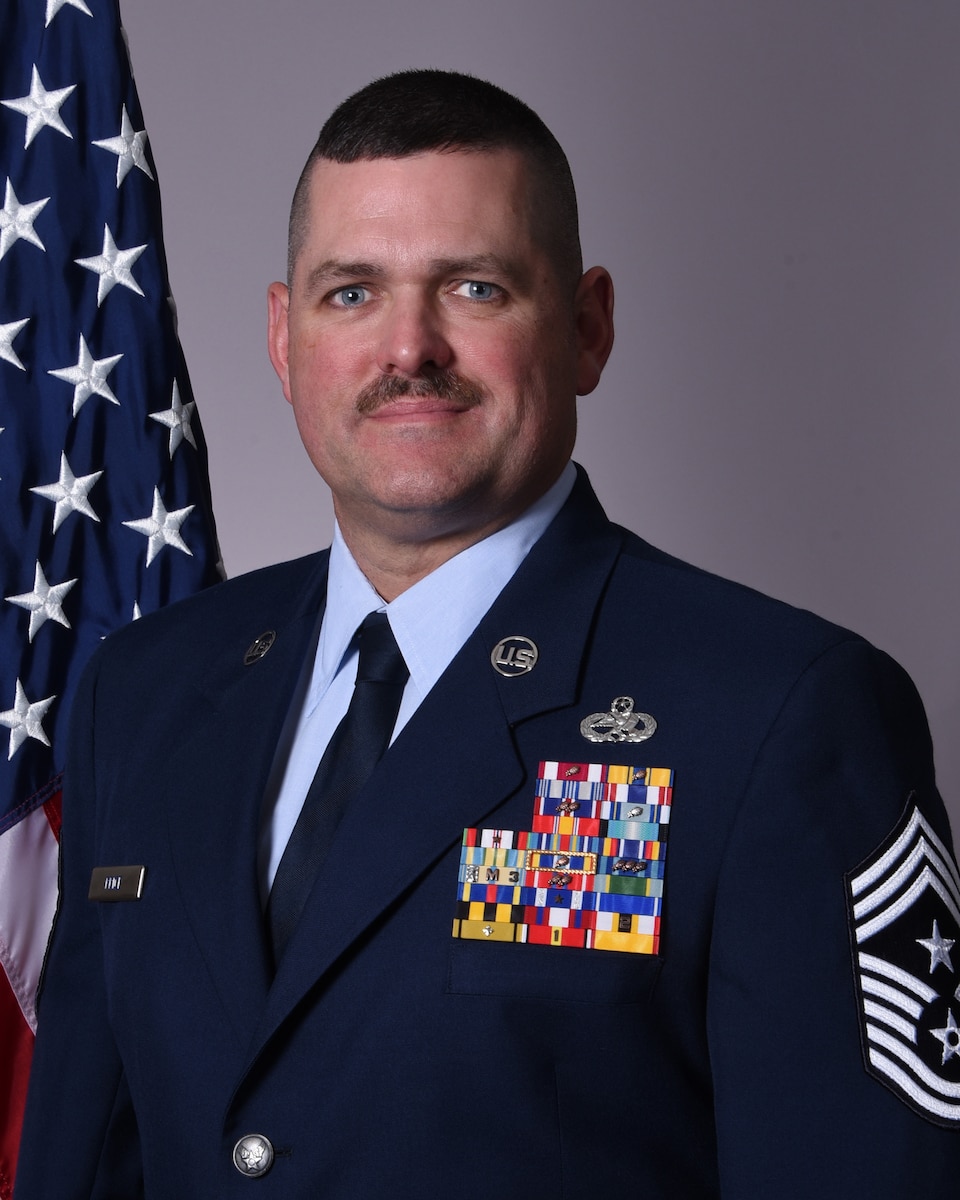 U.S. Air Force Chief Master Sgt. Shane Price, 175th Wing command chief, poses for a portrait photograph.