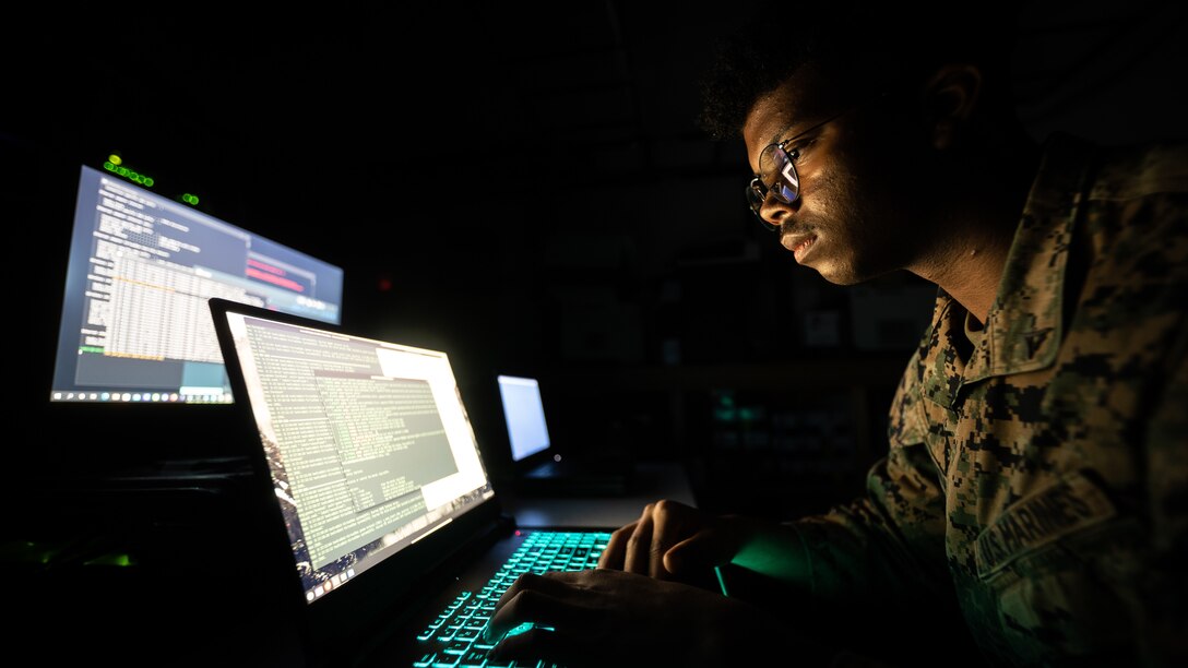 U.S. Marine Corps Lance Cpl. Ram Francis, a data systems administrator with  Headquarters Battalion, 23rd Marine Regiment, from San Francisco, monitors network traffic and activity on Fort Pickett, Virginia, Feb. 6, 2022. Working as a data systems administrator provides Francis, a computer science student, with hands-on experience working with gear that he wouldn't have access to outside of the Marine Corps.