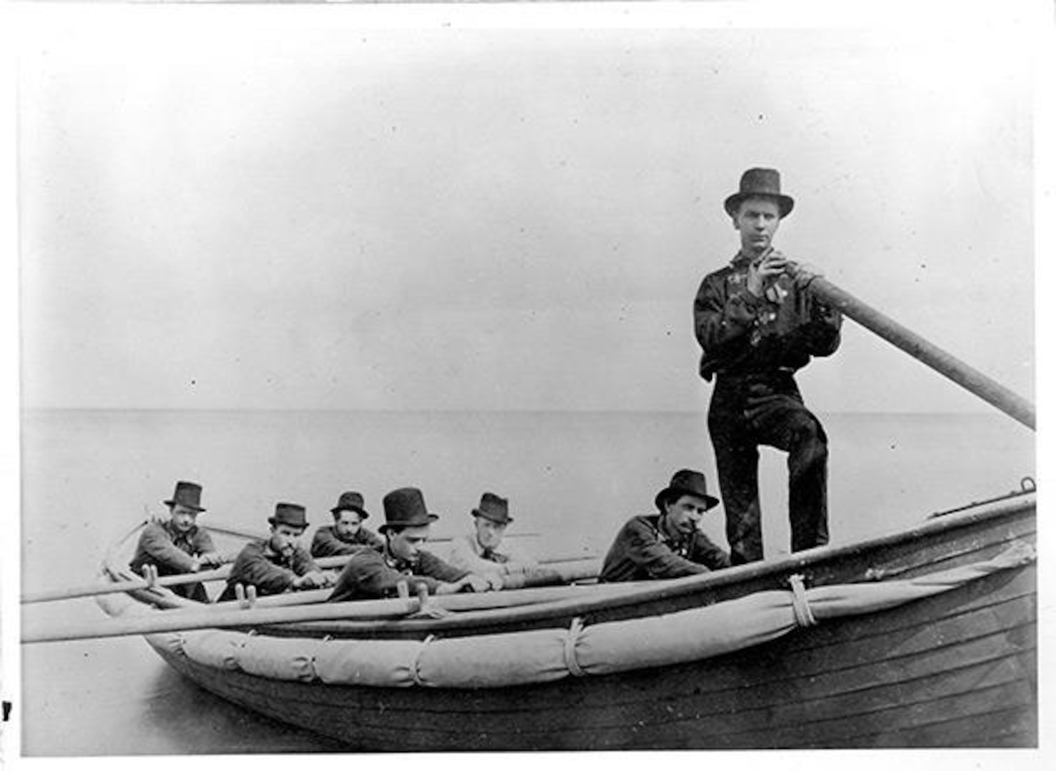 Group photograph taken in 1875 of the student rescue crew and surfboat. (Courtesy of the NWU Deering Library)