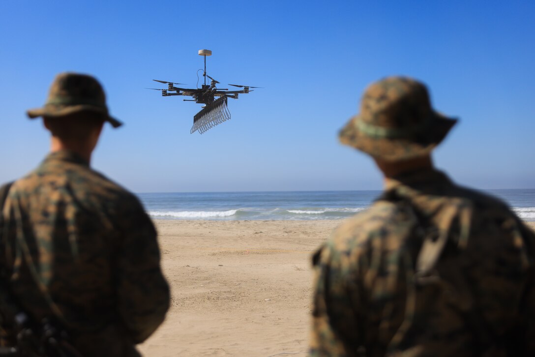 U.S. Marines with 1st Combat Engineer Battalion, 1st Marine Division, observe a Standoff Radar Imaging System-Sky Glass during Technical Concept Experiment 22.2 on Marine Corps Base Camp Pendleton, California, Sept. 27, 2022. TCE brings together Marines and contractors to experiment with new and emerging technologies to enable Marine forces to operate effectively in distributed and expeditionary advanced base operations. SoRIDS-Sky Glass is an unmanned aircraft system with 3D radar systems that can improve the speed and safety of military operations. (U.S. Marine Corps photo by Lance Cpl. Daniel)