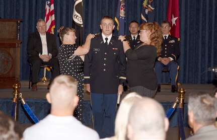 Noah Gledhill, Missouri Army National Guard, is pinned as a 2nd Lieutenant during the graduation of Officer Candidate Class 60. The ceremony was held in the Missouri State Capital building's rotunda on 10 September, 2022.