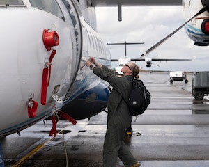 Lt. Col. Caitlin Reilly conducts pre-flight inspections Oct. 25, 2022, at Hurlburt Field, Fla. The Department of the Air Force recently introduced new procedures that empower female aircrew to make the most informed decisions about whether to fly while pregnant. (U.S. Air Force photo by Airman 1st Class Caleb Pavao)