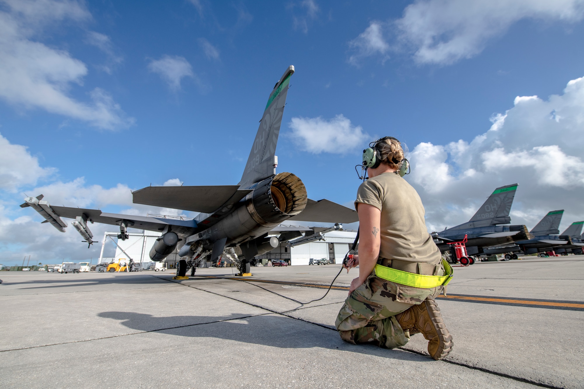 U.S. Air Force Staff Sgt. Jennifer Price, an F-16 crew chief assigned to the Ohio National Guard's 180th Fighter Wing, launches an F-16 Fighting Falcon for a training flight at Naval Air Station Key West, Florida, Nov. 1, 2022. The 180FW deployed to Key West to train with VFC-111, the Navy's premier adversary squadron.

*Some photographic elements have been blurred for security purposes