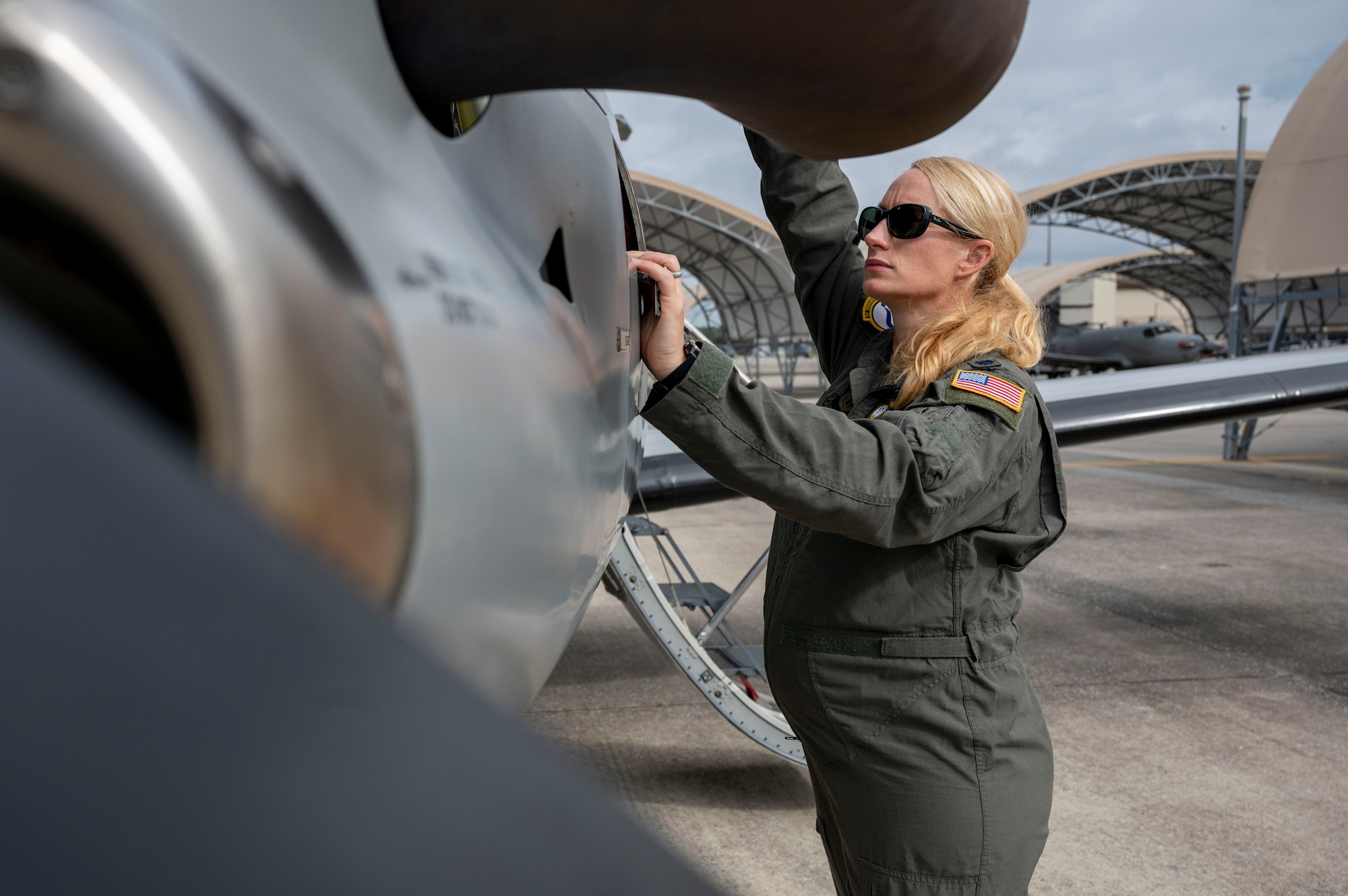 Lt. Col. Caitlin Reilly conducts pre-flight inspections Oct. 25, 2022, at Hurlburt Field, Fla. The Department of the Air Force recently introduced new procedures that empower female aircrew to make the most informed decisions about whether to fly while pregnant. (U.S. Air Force photo by Airman 1st Class Caleb Pavao)