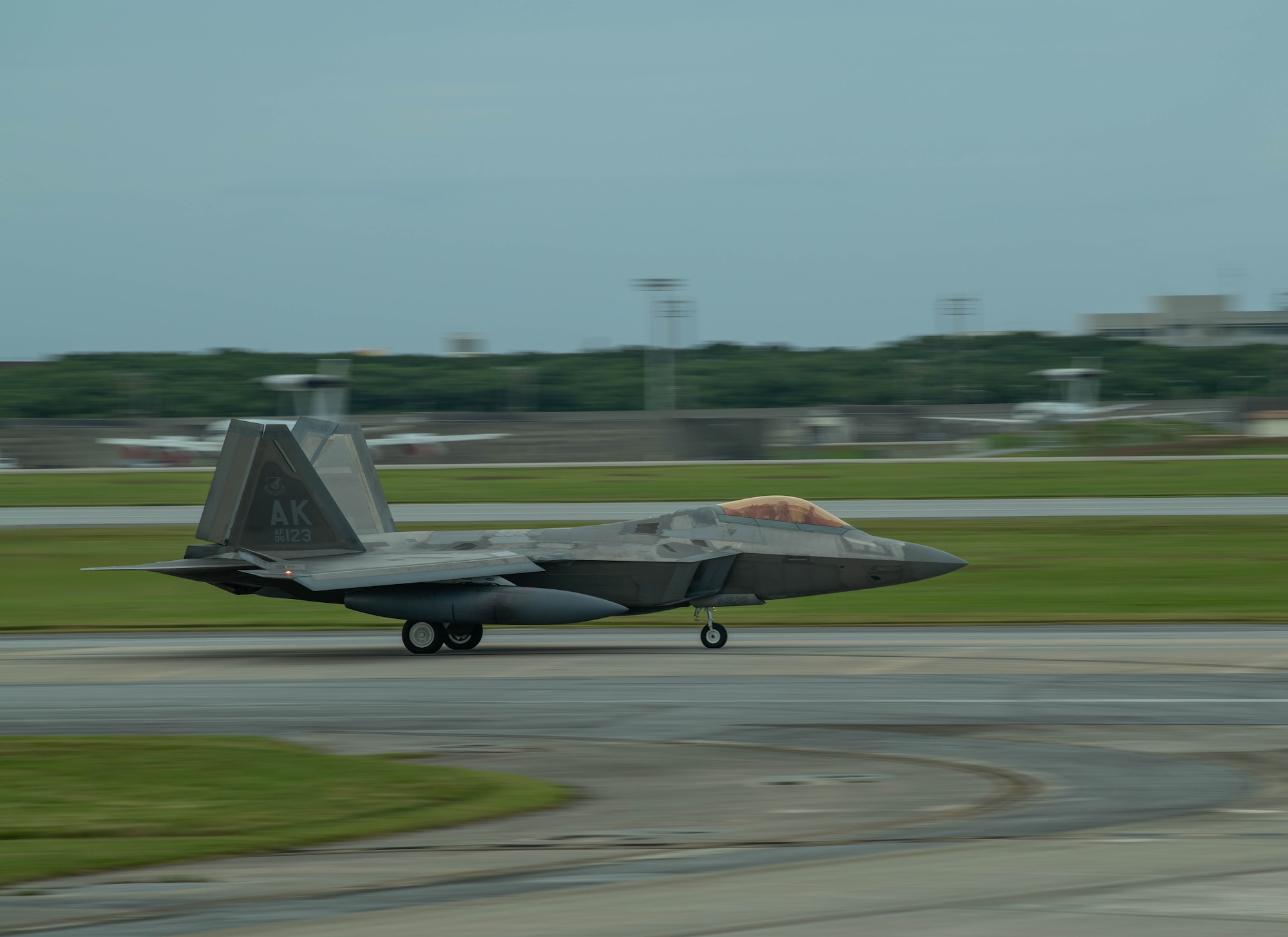 F-22A Raptor lands on runway.