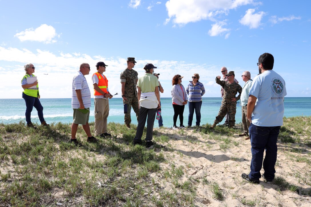 U.S. Marines and civilian employees of Marine Corps Base Hawaii meet with personnel from the Hawaii Department of Health (DOH) at Pu’uloa Range Training Facility, Marine Corps Base Hawaii, Oct. 27, 2022. The purpose of the visit was to begin a cooperative process between the DOH and MCBH toward analyzing conditions along the PRTF boundary, where state and federal jurisdictions meet. (U.S. Marine Corps photo by Chief Warrant Officer 2 William Faffler)
