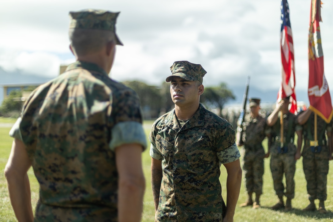 U.S. Marine Corps Cpl. Robert Farmer, a small arms technician with 1st Battalion, 12th Marines, 3d Marine Division is awarded the Navy and Marine Corps Medal at Marine Corps Base Hawaii, Nov. 2, 2022. Farmer was awarded for saving a woman’s life after she was swept off a cliff into the ocean. The Navy and Marine Corps Medal is the highest non-combat award for heroism awarded to members of the U.S. Navy and Marine Corps. (U.S. Marine Corps photo by Sgt. Israel Chincio)