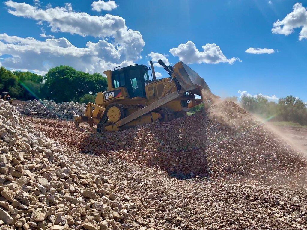 U.S. Army Corps of Engineers Los Angeles District contractors construct a reinforced embankment to protect critical infrastructure against flooding Oct. 5 in Duncan, Arizona. Large stones and rocks are used with sand and soil in a process called rip rap to strengthen embankments dikes and levees.