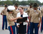 PARRIS ISLAND, S.C. (Nov. 4, 2022) — U.S. Naval Community College's President Randi R. Cosentino, Ed.D., receives a plaque during the graduation ceremony at Marine Corps Recruit Depot Parris Island. Cosentino visited MCRD Parris Island as the parade reviewing official for the graduation ceremony of the 391 Marines of Papa Company, 4th Recruit Training Battalion. The United States Naval Community College is the official community college for the Navy, Marine Corps, and Coast Guard. To get more information about USNCC, go to www.usncc.edu. Click on the Inquire Now link to learn how to be a part of the USNCC Pilot II program. (U.S. Navy photo by Chief Mass Communication Specialist Xander Gamble/released)