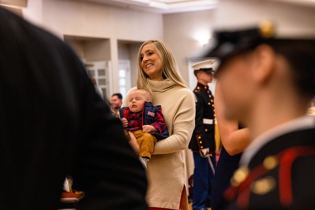 Oliver Moyer, the youngest child in attendance, waits for his birthday cake during the military family dance night held at The Clubs at Quantico, Marine Corps Base Quantico, Virginia, Nov. 2, 2022. The dance provided the opportunity for children to celebrate the Marine Corps birthday as well as share in the experience of a night like the experiences of the actual Marine Corps birthday ball. (U.S. Marine Corps photo by Lance Cpl. Joaquin Dela Torre)