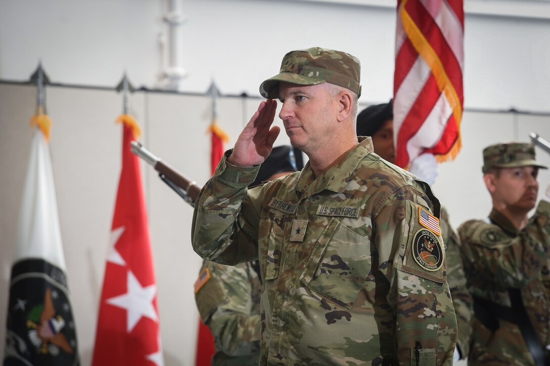 Man in military uniform salutes