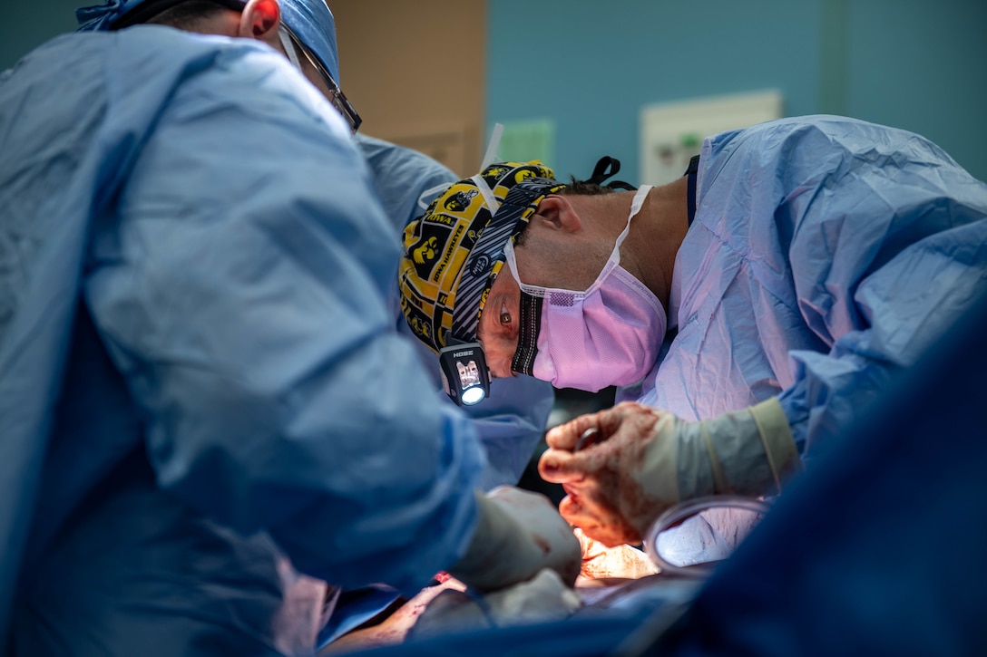 Capt. Timothy Platz, from Dyersville, Iowa, conducts bilateral hernia repair open surgery on a Guatemalan citizen aboard the hospital ship USNS Comfort (T-AH 20), Oct. 28, 2022. Comfort is deployed to U.S. 4th Fleet in support of Continuing Promise 2022, a humanitarian assistance and goodwill mission conducting direct medical care, expeditionary veterinary care, and subject matter expert exchanges with five partner nations in the Caribbean, Central and South America.