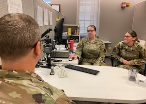 Airman 1st Class Hailey Brewer receives training on creating a Common Access Card in the customer service area of the 127th Force Support Squadron at Selfridge Air National Guard Base, Michigan, Nov. 5, 2022. Senior Airman Heather Burks provided the training. Tech. Sgt. Make Danger, a member of the 127th Civil Engineer Squadron, received the new card. Airmen of the 127th FSS provide a range of personnel services to the 1,700 Citizen-Airmen of the 127th Wing, Michigan Air National Guard. (U.S. Air National Guard photo by Master Sgt. Dan Heaton)