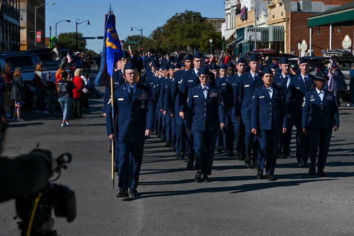 Airmen assigned to Goodfellow Air Force Base march during the San Angelo All Veterans Council Veterans Day parade downtown, San Angelo, Texas, Nov. 5, 2022. The flight was made up of 75 Airmen signifying the 75th anniversary of the United States Air Force. (U.S. Air Force photo by Senior Airman Michael Bowman)