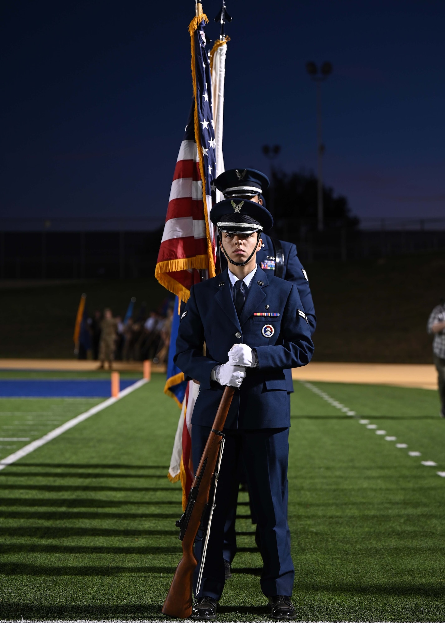 Goodfellow Air Force Base Honor Guardsmen prepare to present the colors at Military Appreciation Night, Angelo State University, Nov. 5, 2022. Military members and veterans were honored throughout the day at festivities before the game. (U.S. Air Force photo by Senior Airman Ethan Sherwood)