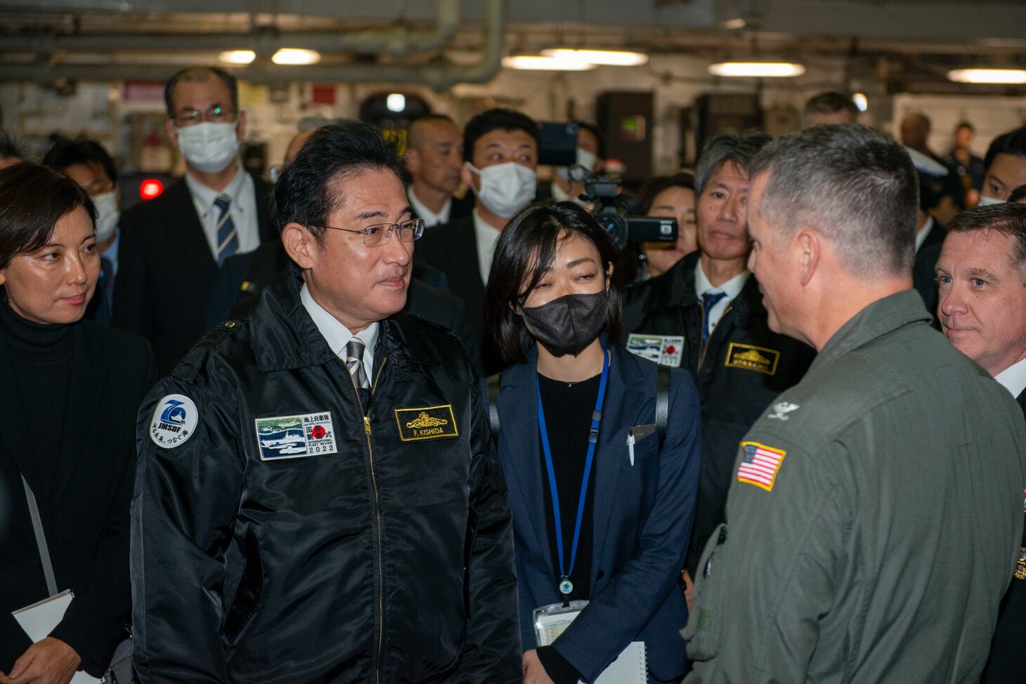 SAGAMI WAN (Nov. 6, 2022) Japan Prime Minister Fumio Kishida tours the hangar, led by Capt. Michael Sweeny, commander, Carrier Air Wing 5, aboard the U.S. Navy’s only forward-deployed aircraft carrier, USS Ronald Reagan (CVN 76), during the Japan Maritime Self-Defense Force Fleet Review 2022, in the Sagami Wan, Nov. 6. Ronald Reagan, the flagship of Carrier Strike Group 5, provides a combat-ready force that protects and defends the United States, and supports alliances, partnerships and collective maritime interests in the Indo-Pacific region. (U.S. Navy photo by Mass Communication Specialist 2nd Class Michael B. Jarmiolowski)