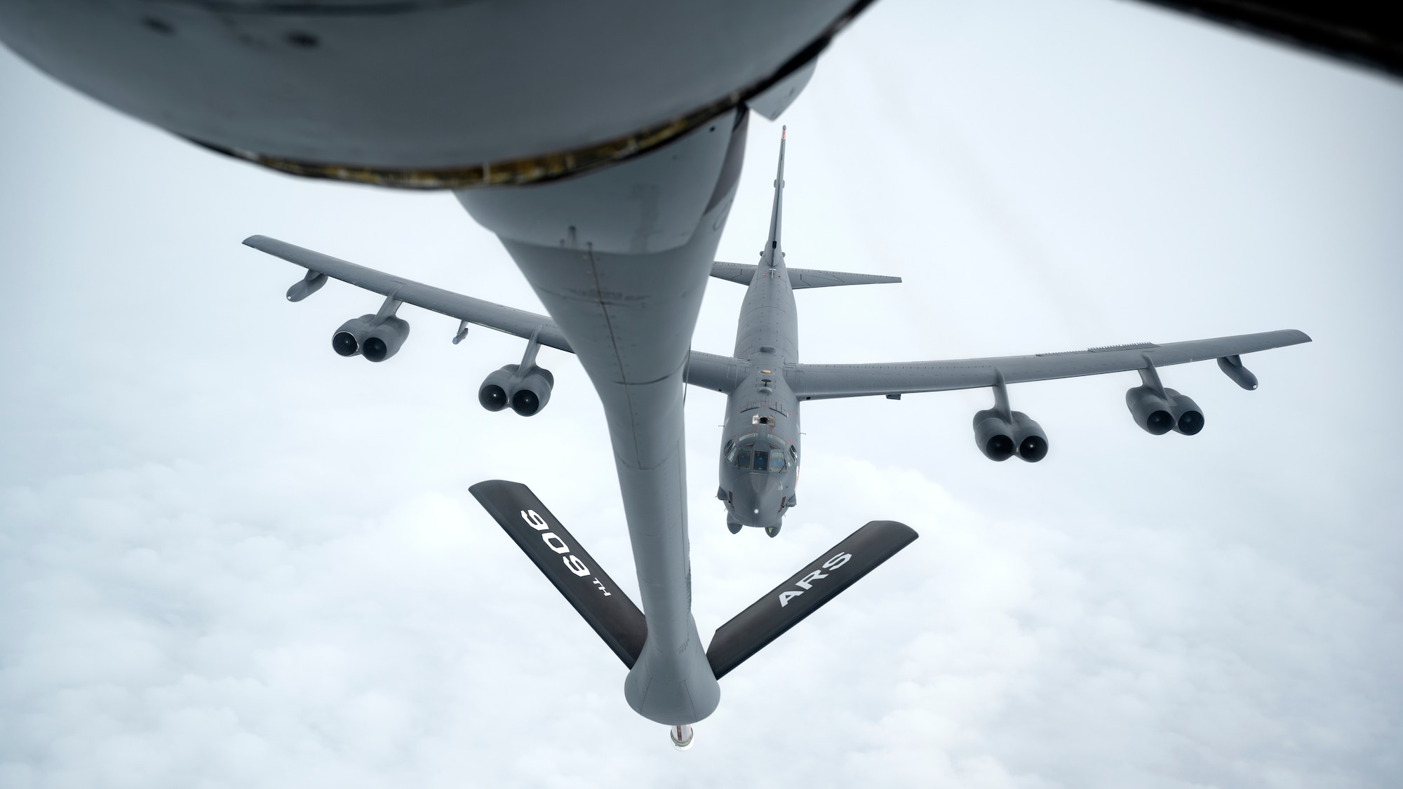 A U.S. Air Force 5th Bomb Wing B-52H Stratofortress approaches a 909th Air Refueling Squadron KC-135 Stratotanker for aerial refueling over the Pacific Ocean, Oct. 27, 2022. Aerial refueling capabilities extend airborne training time and combat radius, ensuring U.S. and Allied nation aircraft are postured to maintain regional peace and stability within the Indo-Pacific area of responsibility. (U.S. Air Force photo by Senior Airman Jessi Roth)