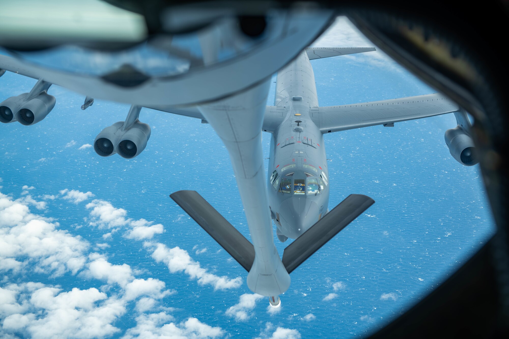 A U.S. Air Force 5th Bomb wing assumes position to recieve fuel from a U.S. Air Force KC-135 Stratotanker assigned to the 909th Air Refueling Squadron over the Pacific Ocean, Oct. 27, 2022. Kadena Air Base is the hub of airpower in the Pacific, and home to the 18th Wing and a variety of associate units to form a world-class combat team ready to ensure peace and stability across the Indo-Pacific. (U.S. Air Force photo by Airman Alexis Redin)