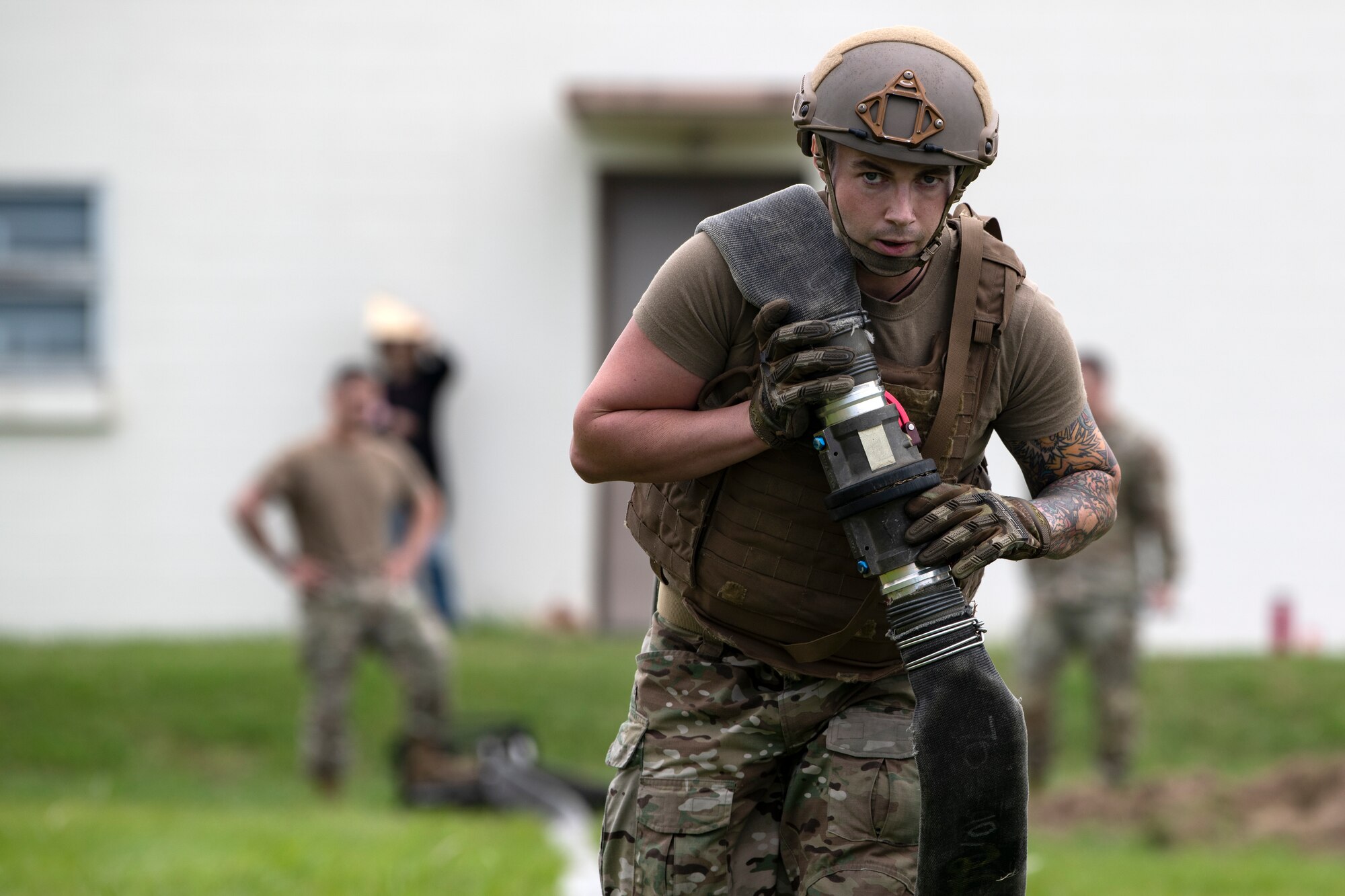 U.S. Air Force Staff Sgt. Lucas Berg, 18th Logistics Readiness Squadron fuels training and support supervisor, drags a 300 foot hose during tryouts for the Forward Area Refueling Point team at Kadena Air Base, Japan, Oct. 21, 2022. The trials are designed to push Airmen beyond their exhaustion point, allowing the FARP team to effectively identify candidates with the potential to withstand the rigors of special operations missions. (U.S. Air Force photo by Senior Airman Jessi Roth)
