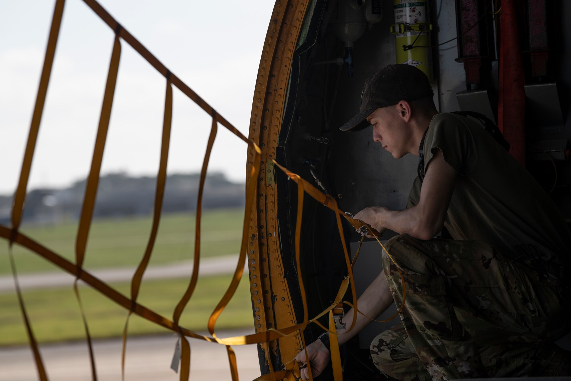 Airman 1st Class Ethan Parker, 909th Air Refueling Squadron boom operator, preps the aircraft for take-off in support of a joint training exercise over the Pacific Ocean, Oct. 24, 2022. Joint training strengthens partnerships and enhances capabilities, allowing the U.S. to maintain air supremacy and ensure a free and open Indo-Pacific. (U.S. Air Force photo by Senior Airman Jessi Roth)