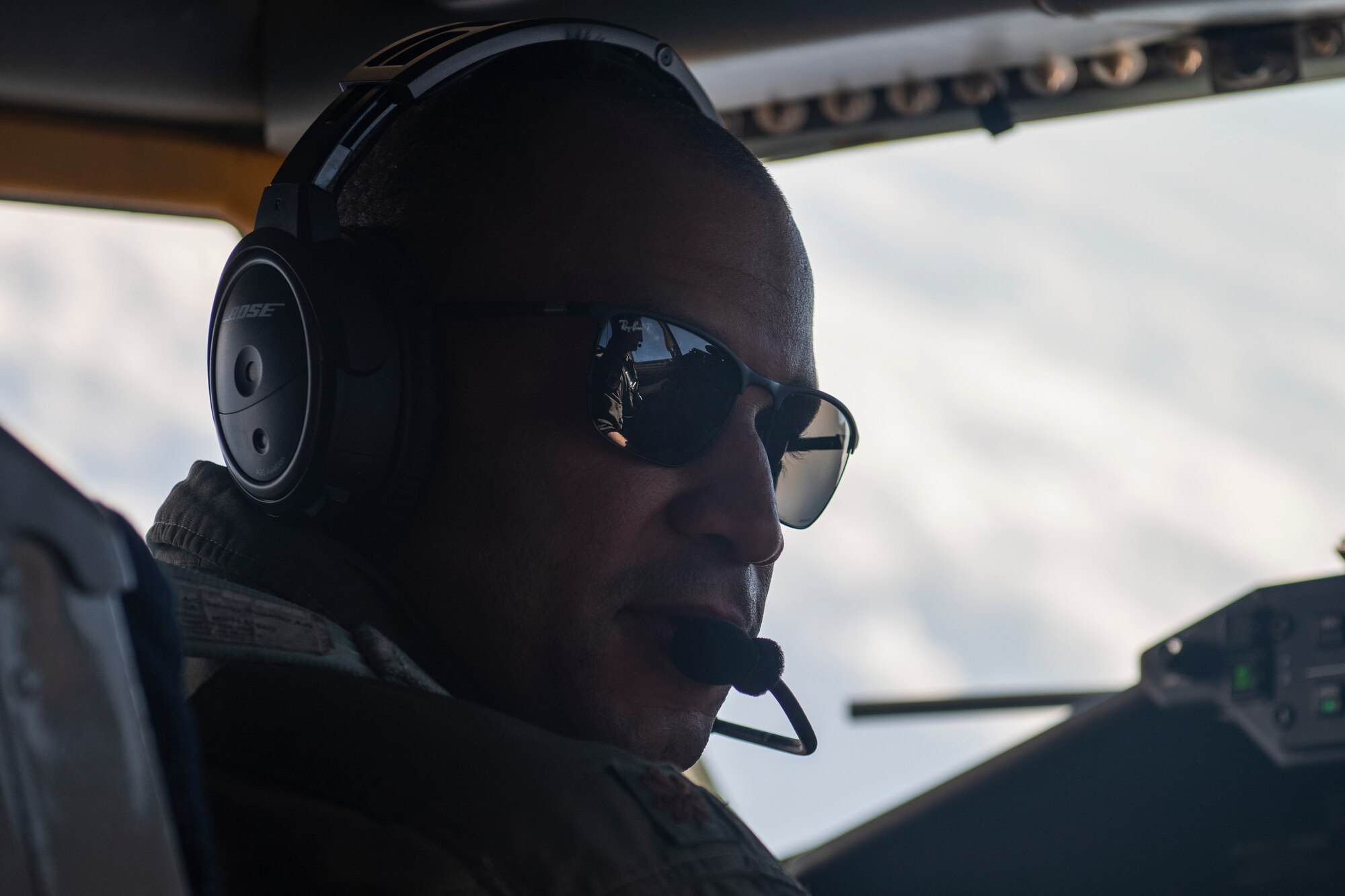 U.S. Air Force Maj. Michael Trott, 909th Air Refueling Squadron KC-135 Stratotanker pilot, talks to his co-pilot during a refueling flight in support of a joint training exercise over the Pacific Ocean, Oct. 24, 2022. Interoperability among U.S. military branches is vital to ensuring a free and open Indo-Pacific by demonstrating the ability to seamlessly integrate and accomplish the mission as one cohesive team. (U.S. Air Force photo by Senior Airman Jessi Roth)