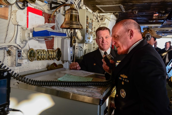 SAGAMI WAN (Nov. 6, 2022) Adm. Mike Gilday, right, chief of naval operations, speaks to the crew using the ship’s 1MC announcement system in the pilot house of the U.S. Navy’s only forward-deployed aircraft carrier, USS Ronald Reagan (CVN 76), as part of a ship tour during the Japan Maritime Self-Defense Force Fleet Review 2022 in the Sagami Wan, Nov. 6. Ronald Reagan, the flagship of Carrier Strike Group 5, provides a combat-ready force that protects and defends the United States, and supports alliances, partnerships and collective maritime interests in the Indo-Pacific region. (U.S. Navy photo by Mass Communication Specialist 3rd Class George Cardenas)