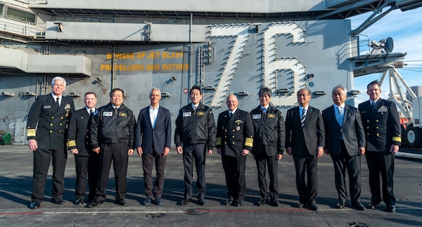 SAGAMI WAN (Nov. 6, 2022) Japan Prime Minister Fumio Kishida, the Honorable Rahm Emanuel, U.S. ambassador to Japan, Japan Minister of Defense Hamada Yasukazu, Adm. Mike Gilday, chief of naval operations, Adm. Sakai Ryo, Japan Maritime Self-Defense Force (JMSDF) chief of staff, Vice Adm. Karl Thomas, commander, U.S. 7th Fleet, Rear Adm. Buzz Donnelly, commander, Task Force 70, and Capt. Daryle Cardone, commanding officer of the U.S. Navy’s only forward-deployed aircraft carrier, USS Ronald Reagan (CVN 76), pose for a photo on the flight deck during a ship tour as part of the JMSDF Fleet Review 2022 in the Sagami Wan, Nov. 6. Ronald Reagan, the flagship of Carrier Strike Group 5, provides a combat-ready force that protects and defends the United States, and supports alliances, partnerships and collective maritime interests in the Indo-Pacific region. (U.S. Navy photo by Mass Communication Specialist 3rd Class Gray Gibson)