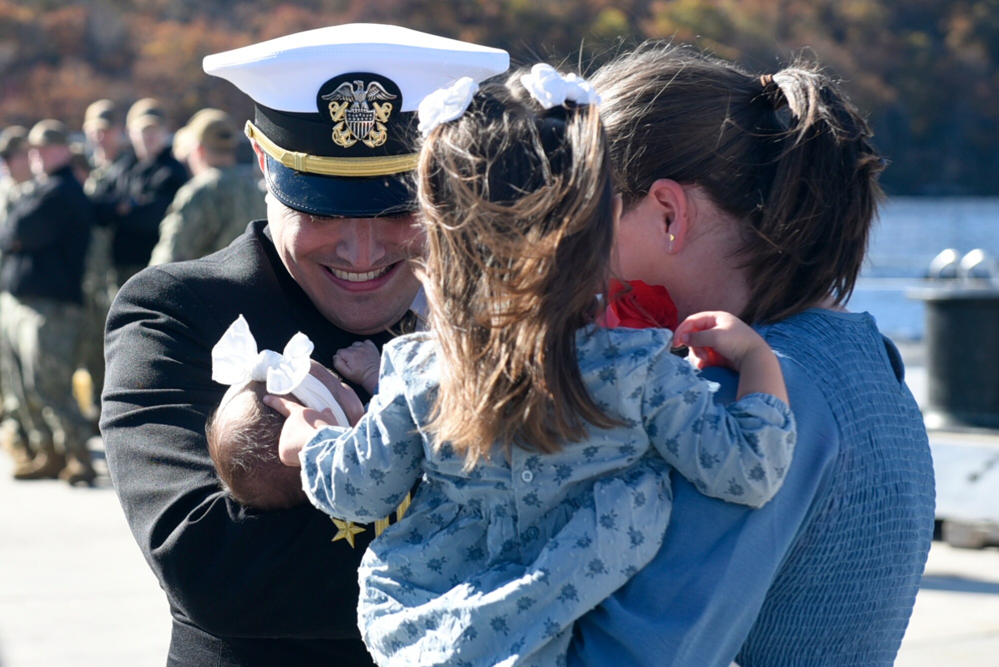 Service member hugs family