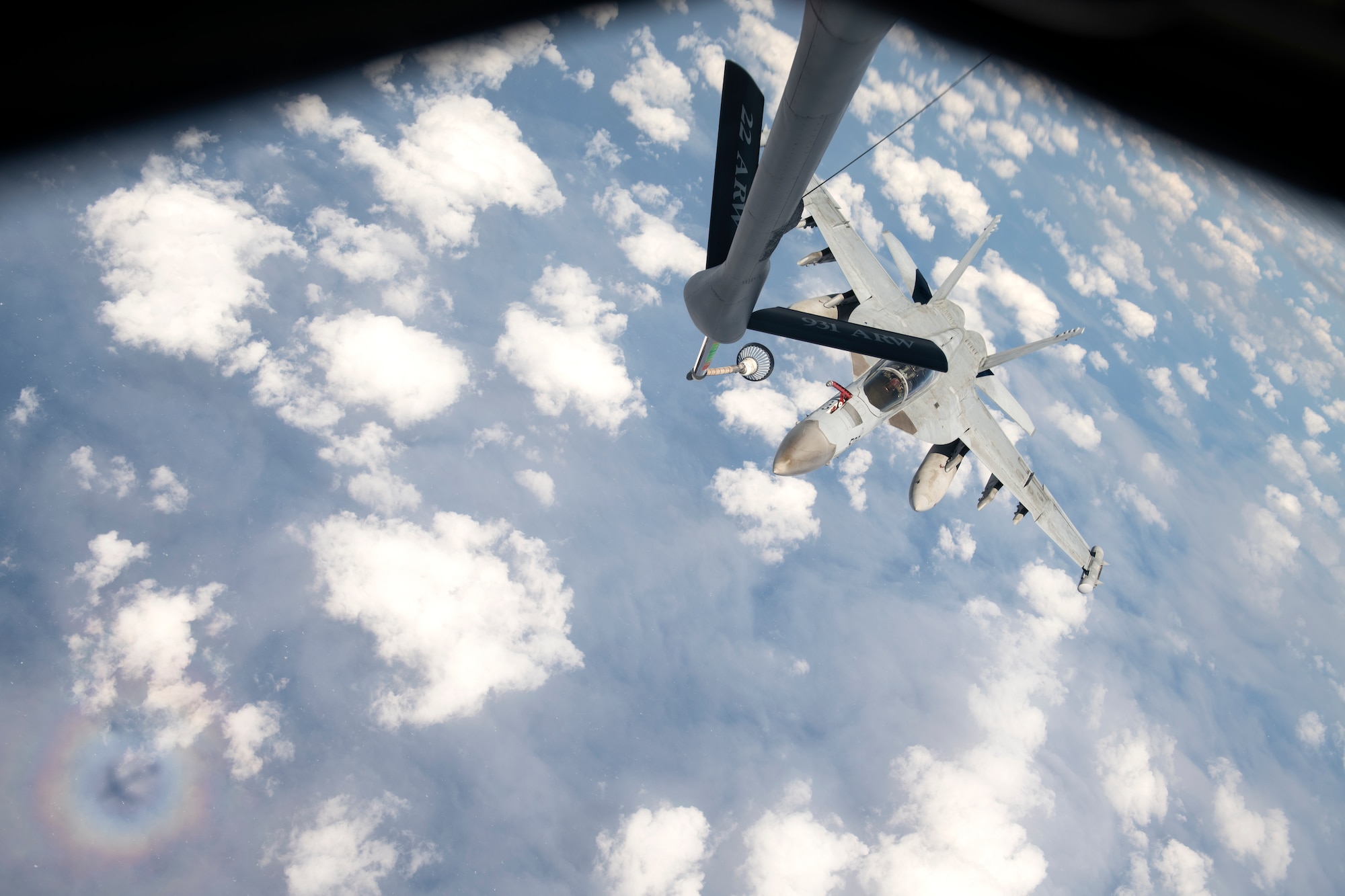 A U.S. Navy F/A-18 Super Hornet approaches a KC-135 Stratotanker assigned to the 909th Air Refueling Squadron during a joint training exercise over the Pacific Ocean, Oct. 24, 2022. Interoperability among U.S. military branches is vital to ensuring a free and open Indo-Pacific by demonstrating the ability to seamlessly integrate and accomplish the mission as one cohesive team. (U.S. Air Force photo by Senior Airman Jessi Roth)