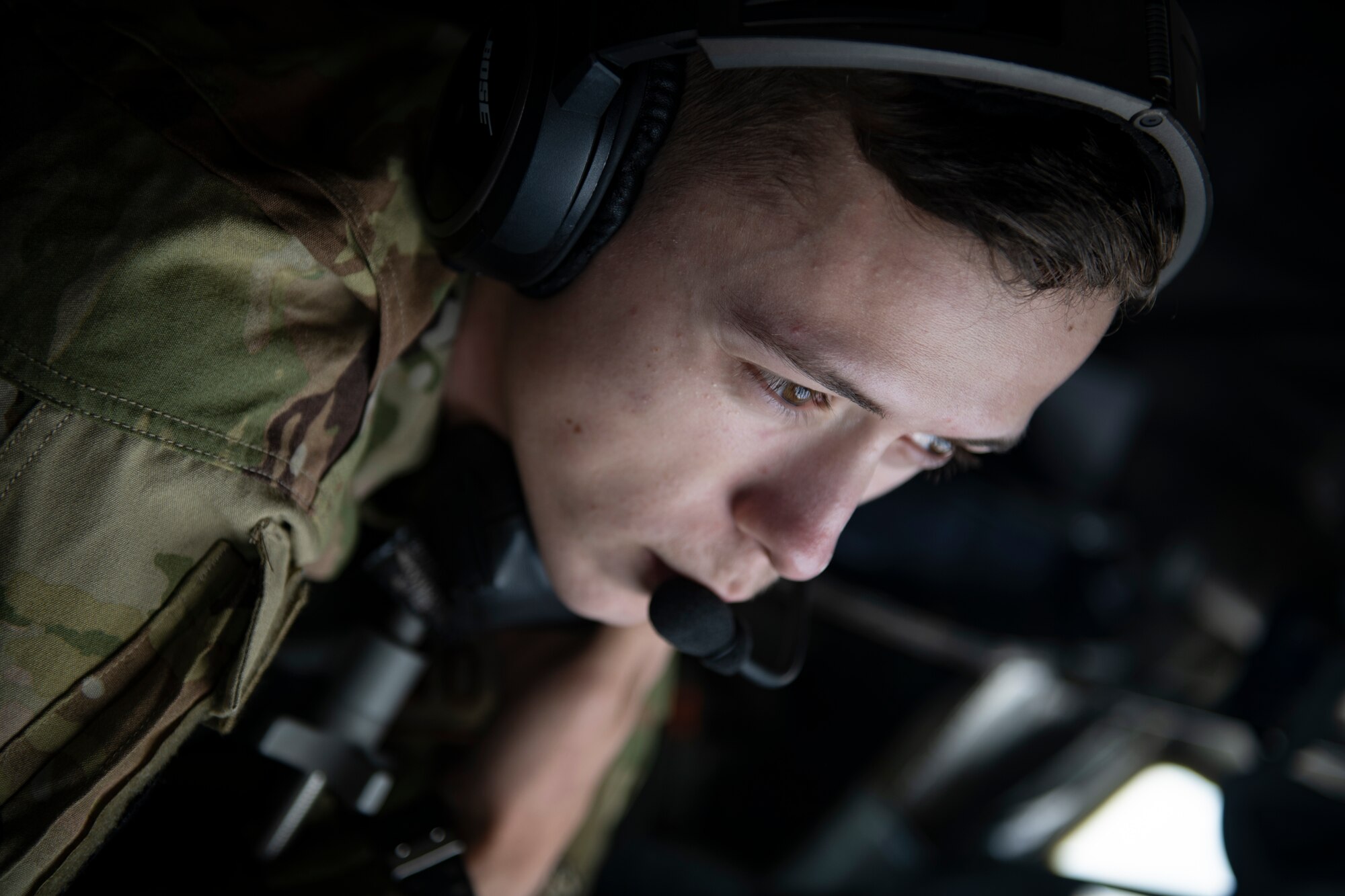 Airman 1st Class Ethan Parker, 909th Air Refueling Squadron boom operator, oversees the refueling of a U.S. Navy F/A-18 Super Hornet during a joint training exercise over the Pacific Ocean, Oct. 24, 2022. Joint training strengthens partnerships and enhances capabilities, allowing the U.S. to maintain air supremacy and ensure a free and open Indo-Pacific. (U.S. Air Force photo by Senior Airman Jessi Roth)