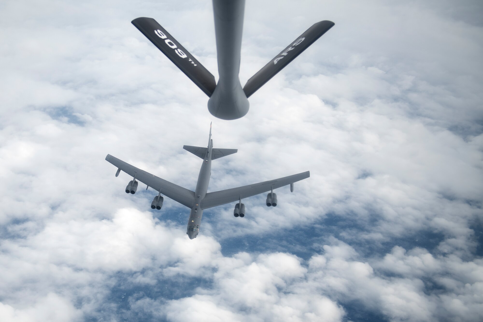 A U.S. Air Force 5th Bomb Wing B-52H Stratofortress departs after receiving fuel from a 909th Air Refueling Squadron KC-135 Stratotanker over the Pacific Ocean, Oct. 27, 2022. Aerial refueling capabilities extend airborne training time and combat radius, ensuring U.S. and Allied nation aircraft are postured to maintain regional peace and stability within the Indo-Pacific area of responsibility. (U.S. Air Force photo by Senior Airman Jessi Roth)