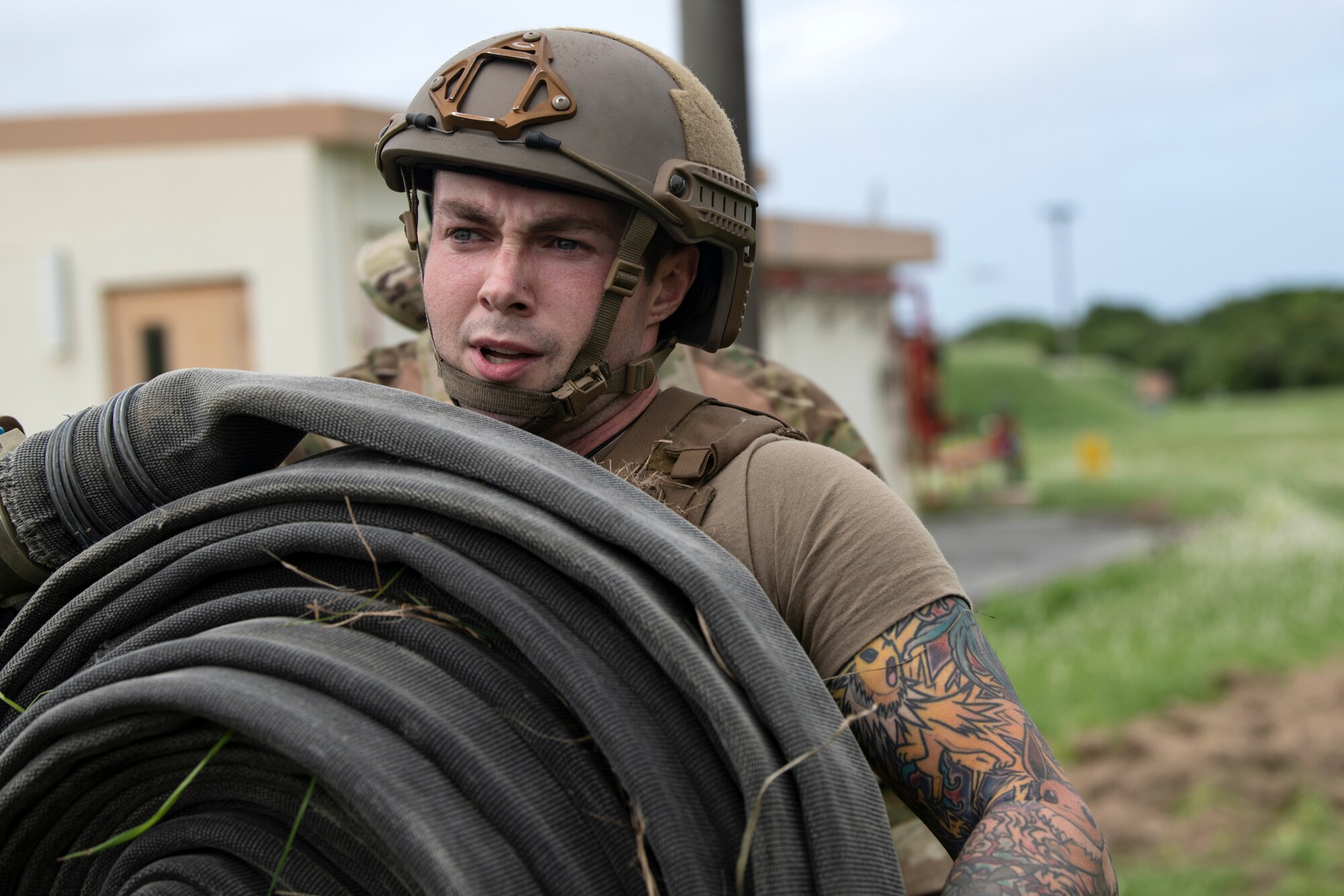 U.S. Air Force Staff Sgt. Lucas Berg, 18th Logistics Readiness Squadron fuels training and support supervisor, carries a 100 pound hose bundle during tryouts for the Forward Area Refueling Point team at Kadena Air Base, Japan, Oct. 21, 2022. Airmen selected to join the team will receive further training to prepare them for special operations at night and in austere environments in support of forward-deployed combat units. (U.S. Air Force photo by Senior Airman Jessi Roth)