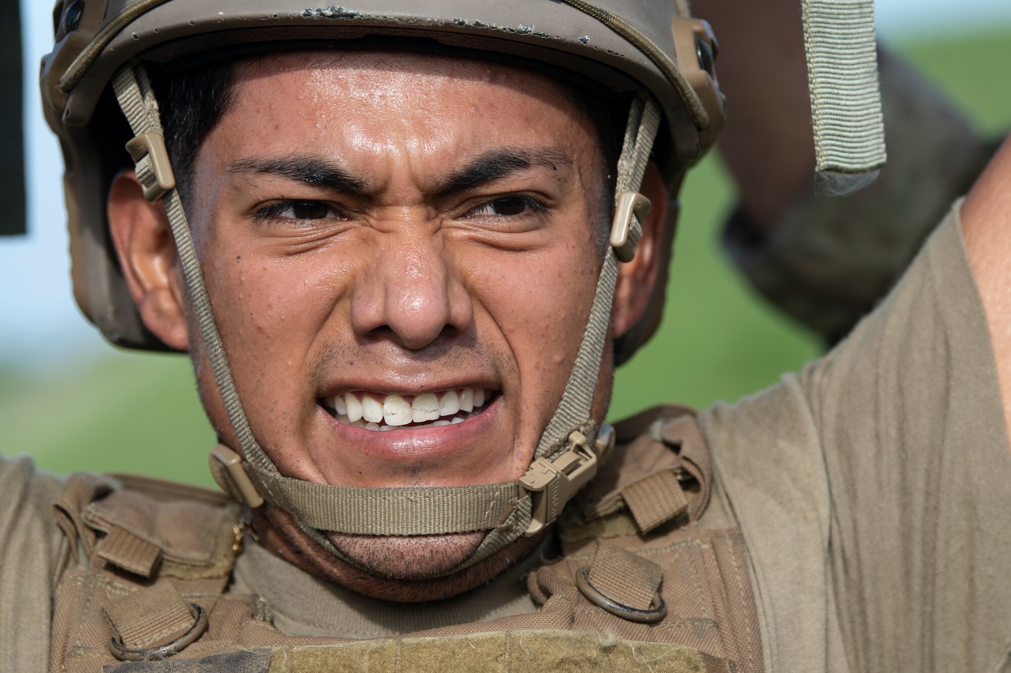 U.S. Air Force Airman Marcos Huerta-Pineda, 18th Logistics Readiness Squadron fuels hydrant operator, holds a 100 pound hose bundle overhead during tryouts for the Forward Area Refueling Point team at Kadena Air Base, Japan, Oct. 21, 2022. The trials are designed to push Airmen beyond their exhaustion point, allowing the FARP team to effectively identify candidates with the potential to withstand the rigors of special operations missions. (U.S. Air Force photo by Senior Airman Jessi Roth)