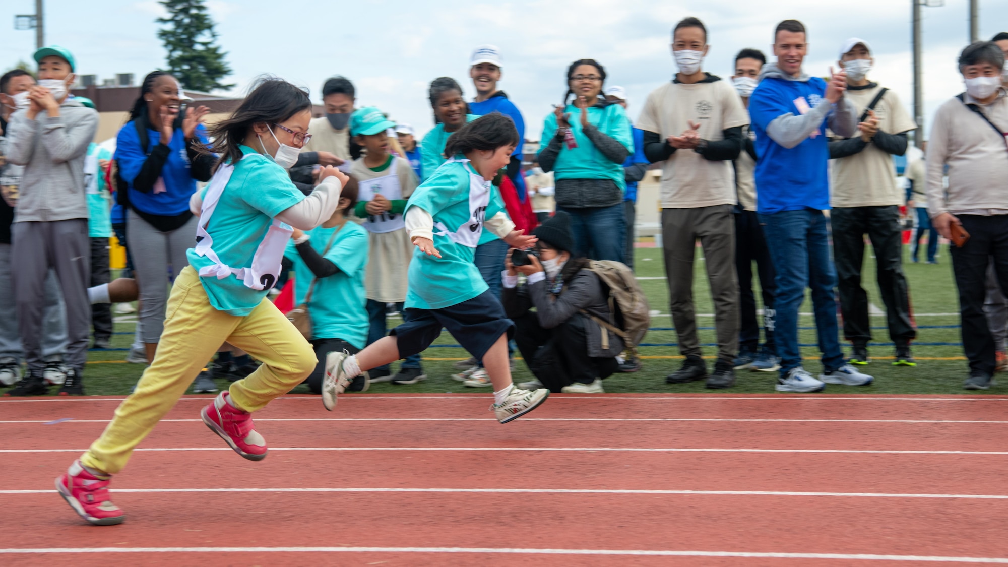 Two Special Olympic Youth Athletes run in the 50m race.