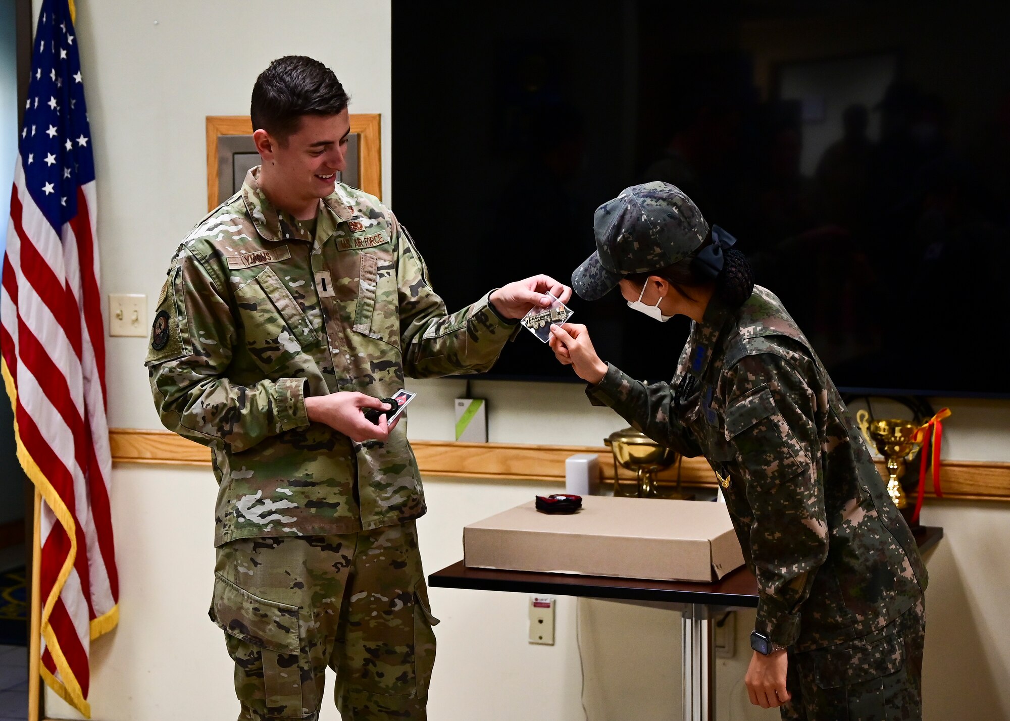 1st Lt. Taylor Yucus, 8th Logistics Readiness Squadron fuels management flight commander, presents a squadron coin to his Republic of Korea Air Force counterpart during a combined immersion at Kunsan Air Base, Republic of Korea, Oct. 27, 2022. In addition to highlighting mission tactics and sharing ideas, the immersion allowed personnel to experience each other’s culture. (U.S. Air Force photo by Staff Sgt. Isaiah J. Soliz)