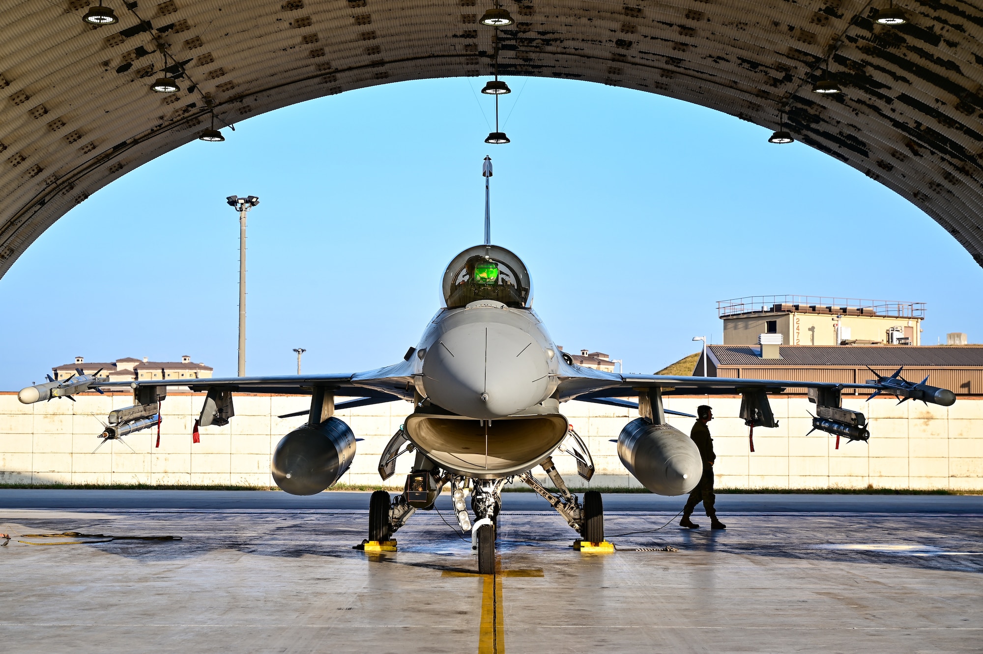 An 80th Fighter Squadron F-16 Fighting Falcon pilot conducts a preflight check prior to departure at Kunsan Air Base, Republic of Korea, Nov. 4, 2022. The F-16’s maneuverability and combat radius--distance it flies to enter combat, stay, fight and return, makes it a threat to many potential adversaries and provides a challenging adversary in training scenarios like the Combined Flying Training Event, VIGILANT STORM 23, sponsored by Pacific Air Forces. (U.S. Air Force photo by Staff Sgt. Sadie Colbert)