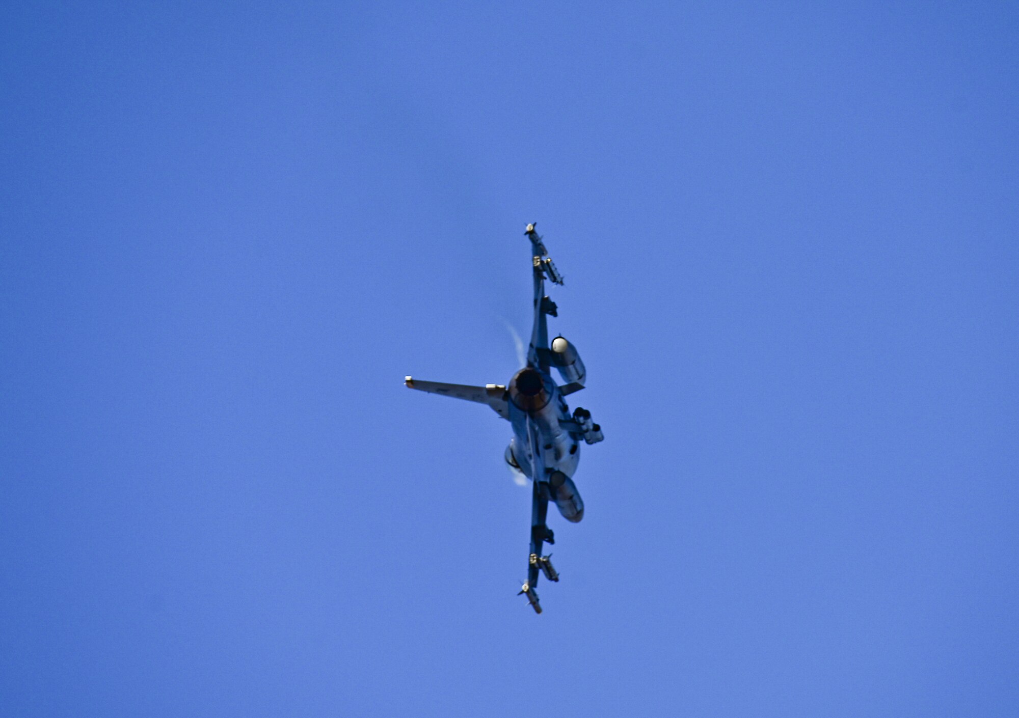 An F-16 Fighting Falcon assigned to the 80th Fighter Squadron banks left after takeoff at Kunsan Air Base, Republic of Korea, Nov. 4, 2022. The F-16’s maneuverability and combat radius--distance it flies to enter combat, stay, fight and return, makes it a threat to many potential adversaries and provides a challenging adversary in training scenarios like the Combined Flying Training Event, VIGILANT STORM 23, sponsored by Pacific Air Forces. (U.S. Air Force photo by Staff Sgt. Sadie Colbert)