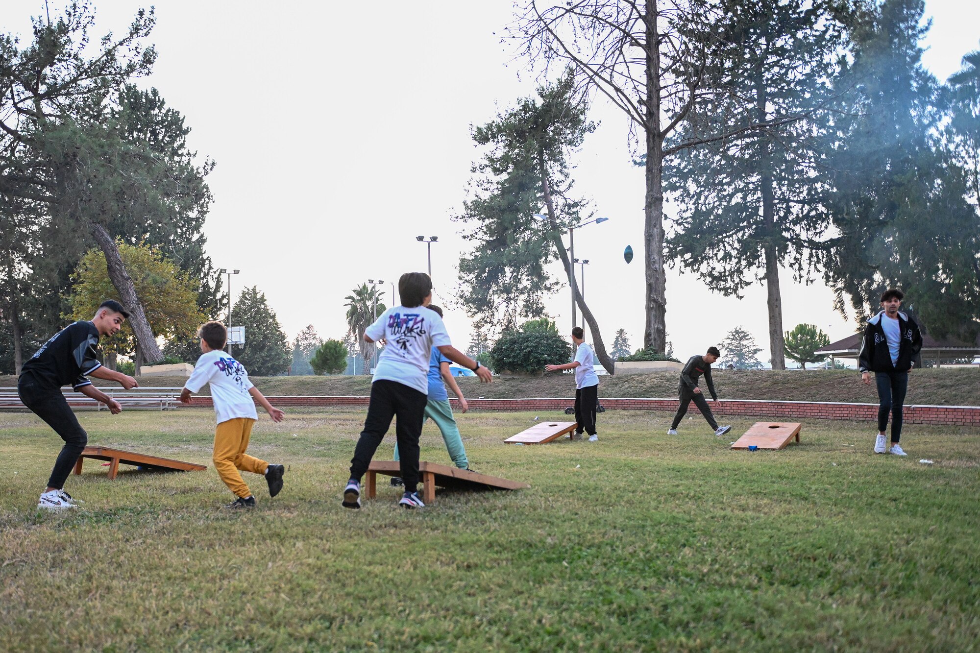 Turkish children play cornhole during the Trunk or Treat event at Incirlik Air Base, Turkey, Oct. 29, 2022.