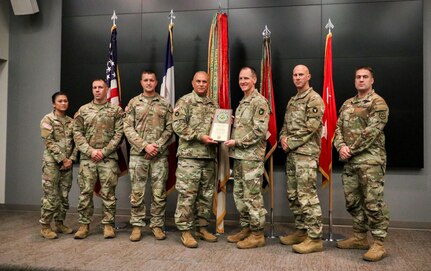 Maj. Gen. Ben Corell, adjutant general of the Iowa National Guard, presents the U.S. Army Chief of Staff’s 2021 Deployment Excellence Award (DEA) to Headquarters & Headquarters Company, 2nd Brigade Combat Team, 34th Infantry Division “Red Bulls,” at Joint Force Headquarters in Johnston, Iowa, Nov. 4, 2022. HHC was awarded the DEA in the small deploying unit category.