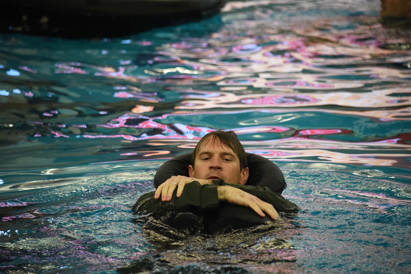 Maj. Addison Harding, an F-16 pilot assigned to the 114th Fighter Wing in Sioux Falls, South Dakota, swims during a SERE refresher course at the Midco Aquatic Center in Sioux Falls Sept. 30, 2022.