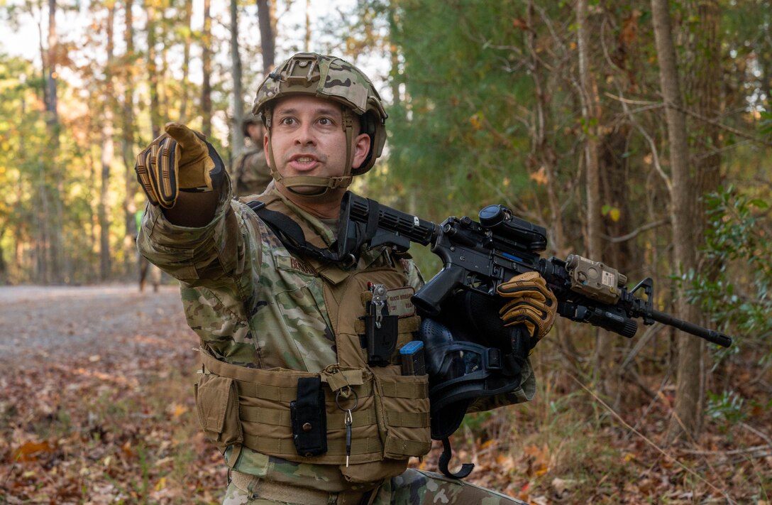 U.S. Air Force Tech. Sgt. Marcus Bernard, 633d Security Forces Squadron flight sergeant, gives directions to his team while on patrol during an exercise at Joint Base Langley-Eustis, Virginia, Nov. 1, 2022.