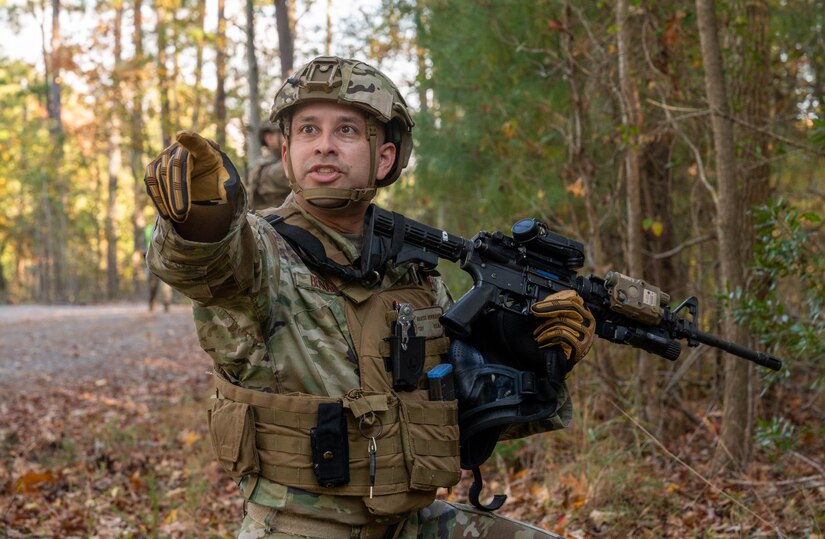 U.S. Air Force Tech. Sgt. Marcus Bernard, 633d Security Forces Squadron flight sergeant, gives directions to his team while on patrol during an exercise at Joint Base Langley-Eustis, Virginia, Nov. 1, 2022.