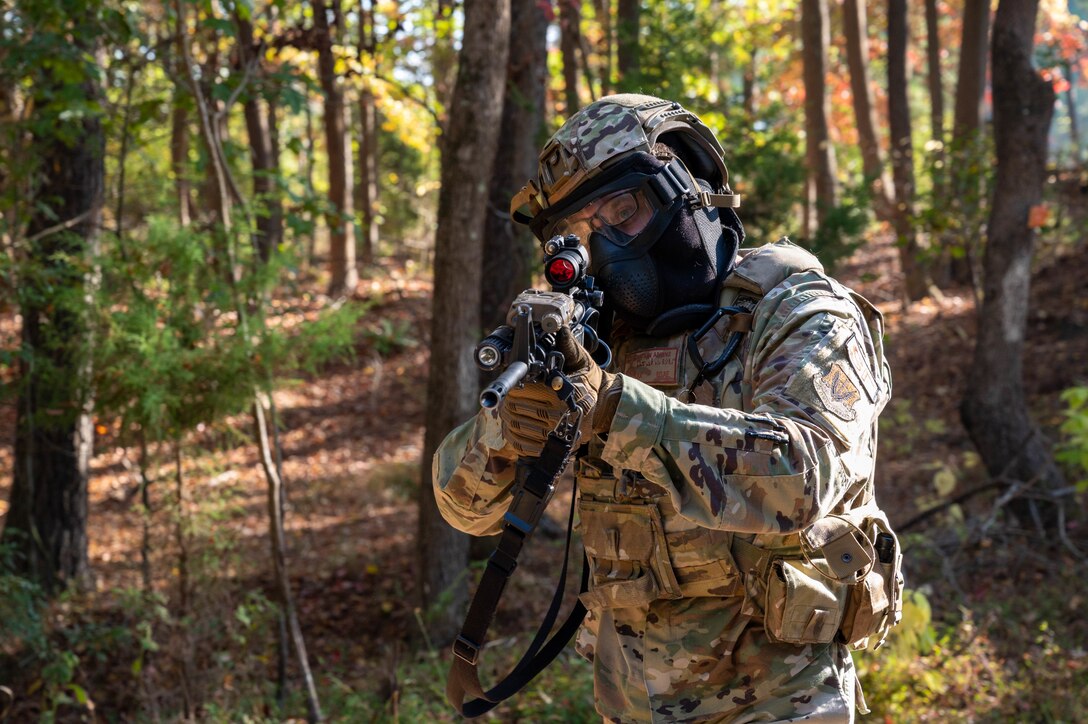 U.S. Air Force Senior Airman Nathan Adkins, 633d Security Forces Squadron response force leader, aims through his sight while on patrol during a field exercise at Joint Base Langley-Eustis, Virginia, Nov. 1, 2022.